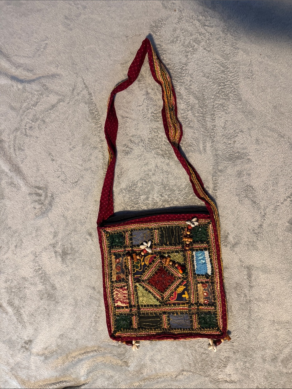 Boho over the shoulder bag with bead and shell accents.